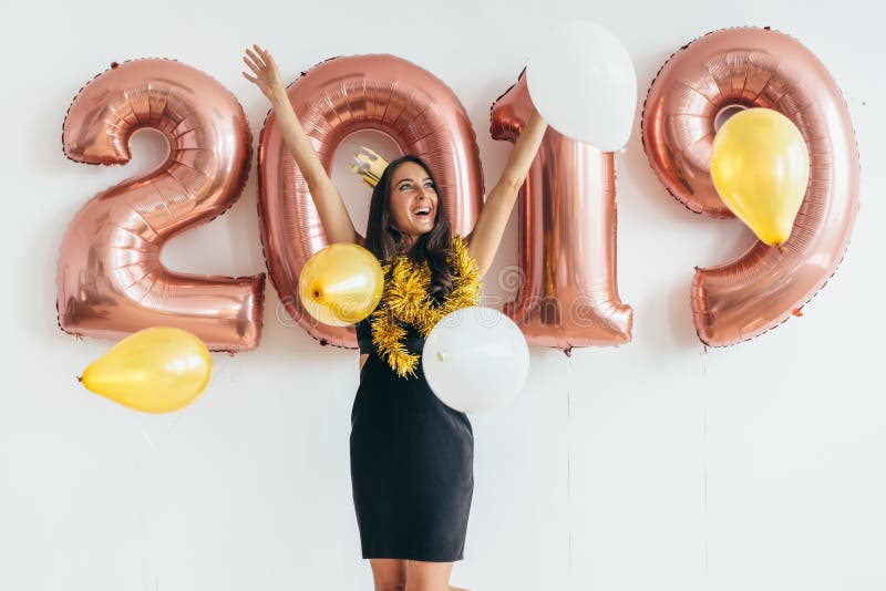 Happy young woman holding balloons Holiday party royalty free stock image Happy young woman holding balloons Holiday party royalty free stock image