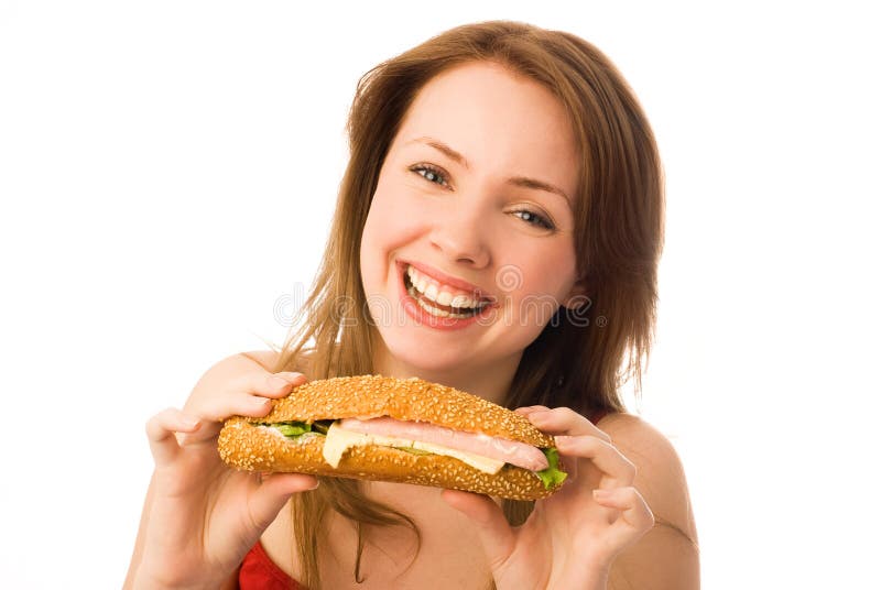 Happy young woman with a hot-dog