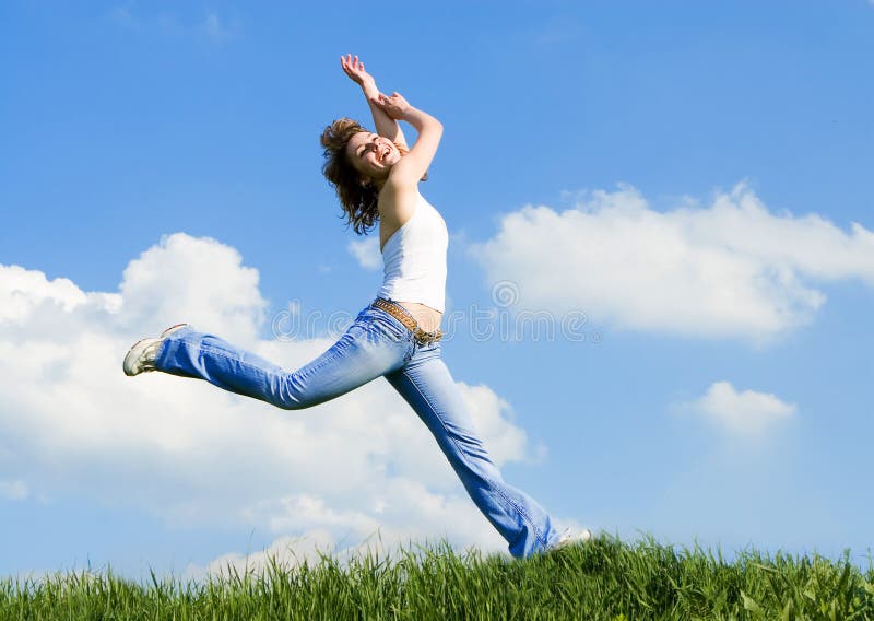 Happy young woman jumping