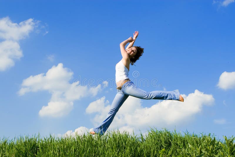 Happy young woman jumping