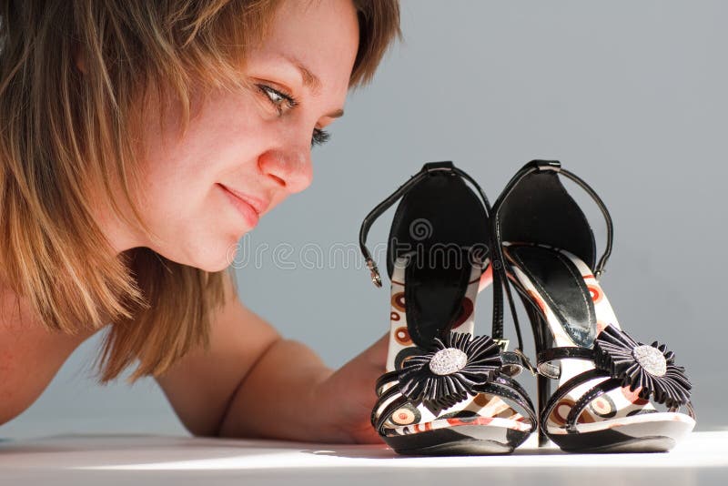 Happy young woman with new shoes