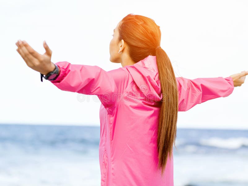 Young woman in sportswear standing at the seaside royalty free stock image Young woman in sportswear standing at the seaside royalty free stock image