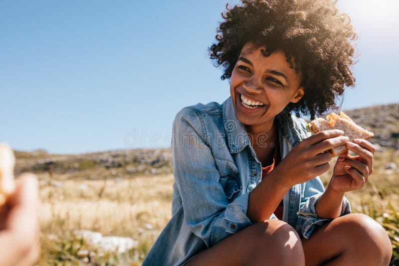 Happy young woman taking break during country hike. stock images Happy young woman taking break during country hike. stock images