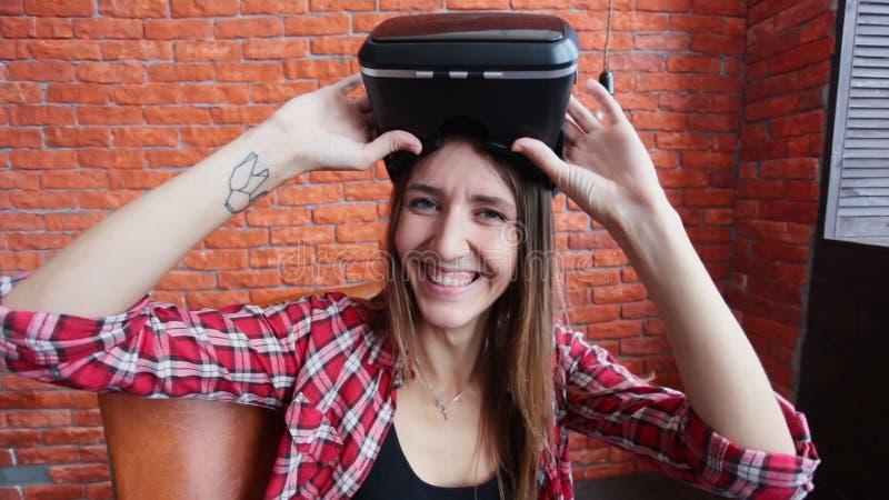 Happy young woman with virtual reality headset