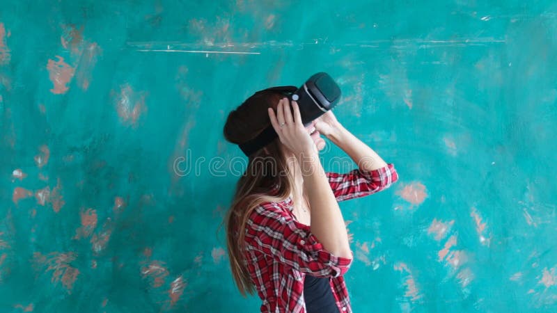 Happy young woman with virtual reality headset