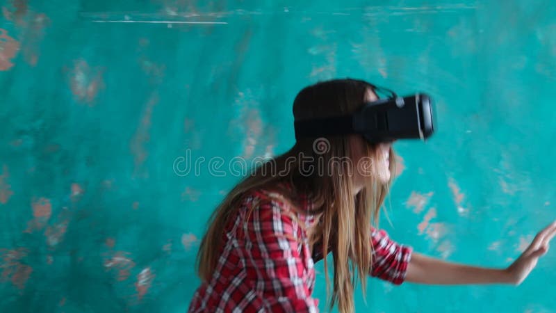 Happy young woman with virtual reality headset