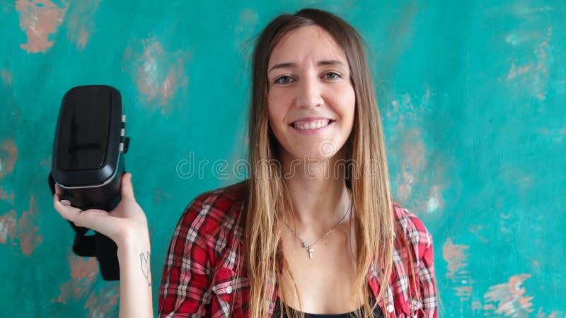 Happy young woman with virtual reality headset