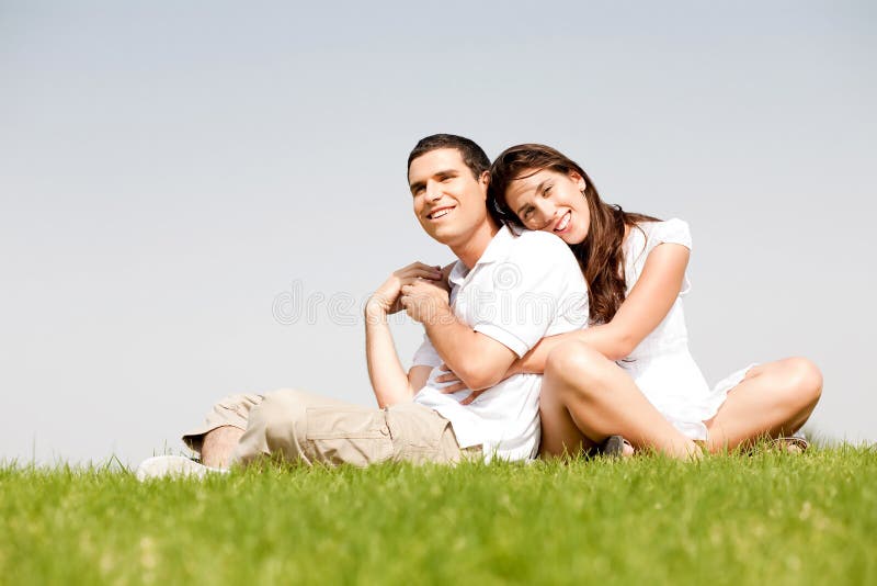 Happy young women with arms around her husband