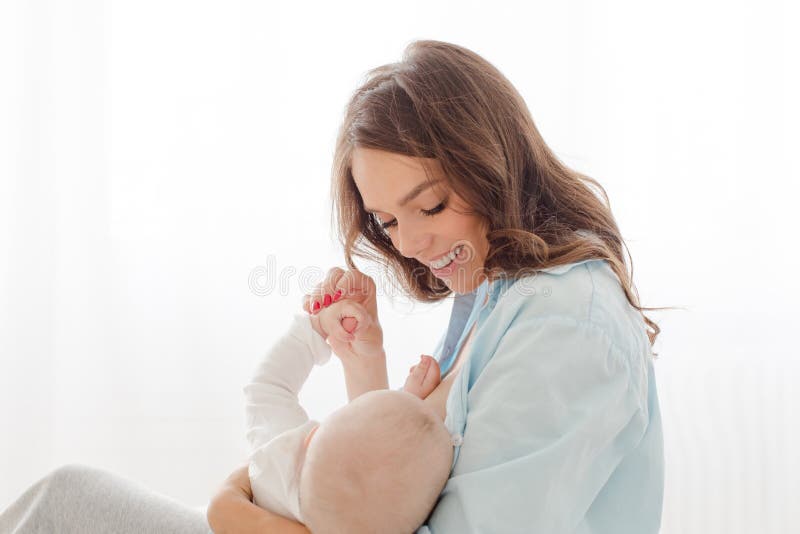 Cheerful woman with baby