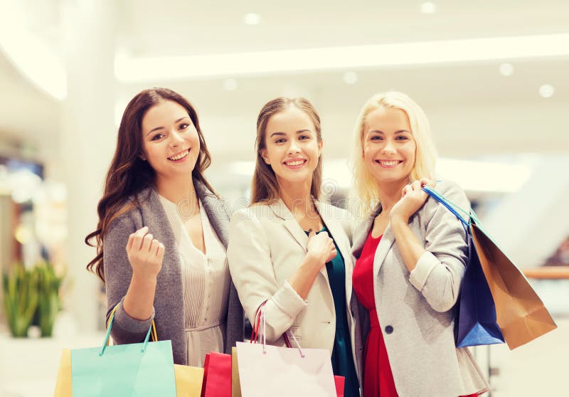 Happy Young Women with Shopping Bags in Mall Stock Image - Image of ...