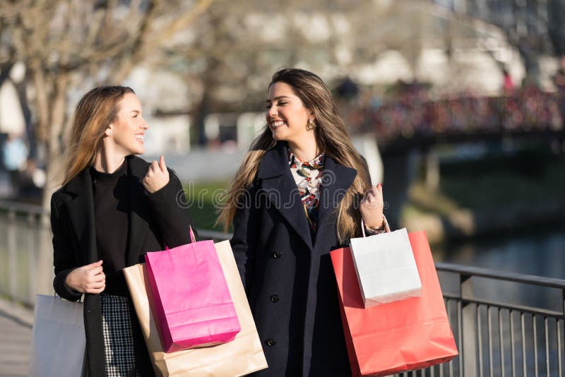 Happy young women with shopping