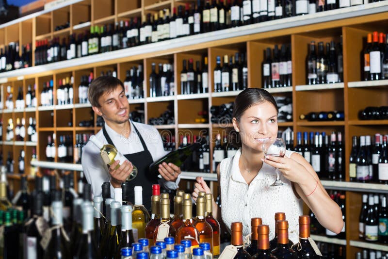 Woman trying glass of wine stock photo. Image of sample - 234576738