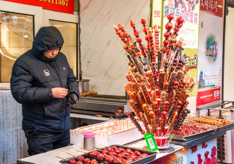 The food shop with Crispy Sugar-Coated Fruit on a Stick or Fruit candy