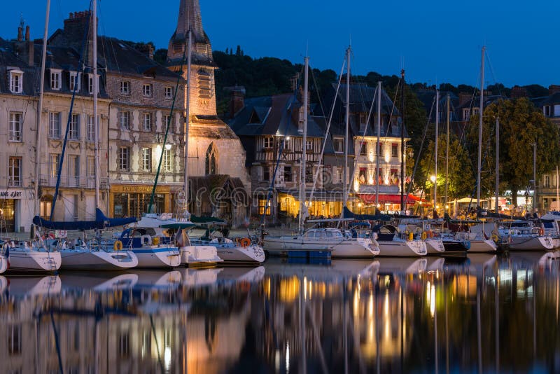 Harbor of historic Frenc city Honfleur with ships and restaurants stock images Harbor of historic Frenc city Honfleur with ships and restaurants stock images
