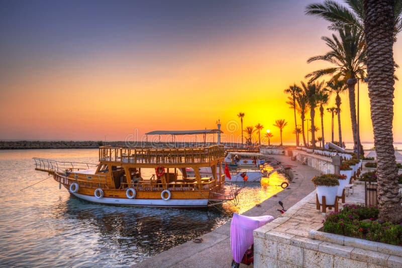 The harbour with boats in Side at sunset