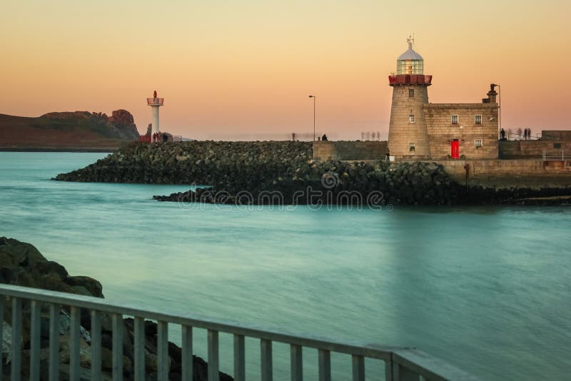 Harbour lighthouse at sunset. Howth. Dublin. Ireland