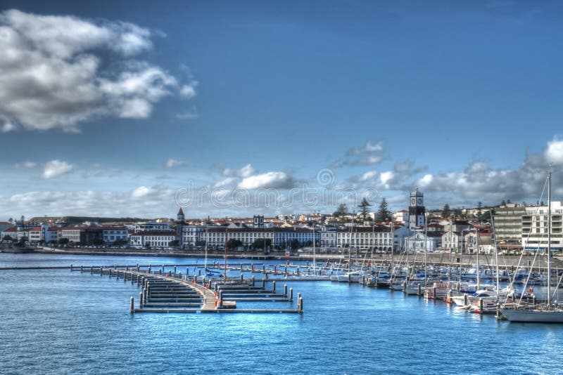 Photograph of the harbor at Ponta Delgata, on the Portuguese island of Soa Miguel, Azores, in the Atlantic Ocean. Photograph of the harbor at Ponta Delgata, on the Portuguese island of Soa Miguel, Azores, in the Atlantic Ocean.