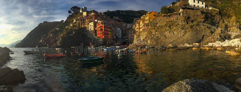 Harbour View of Town of Riomaggiore in Cinque Terre Italy. Harbour View of Town and boats in Riomaggiore in Cinque Terre Italy stock photo Harbour View of Town of Riomaggiore in Cinque Terre Italy. Harbour View of Town and boats in Riomaggiore in Cinque Terre Italy stock photo
