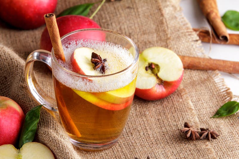 Hard Apple Cider with Cinnamon Stick and Apple Slice Stock Image