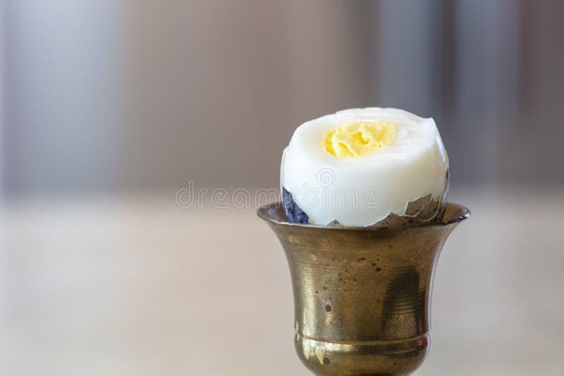 Hard Boiled Quail Egg in a Brass Egg Holder with Shell Cracked Open Stock  Photo - Image of peeled, open: 207499902