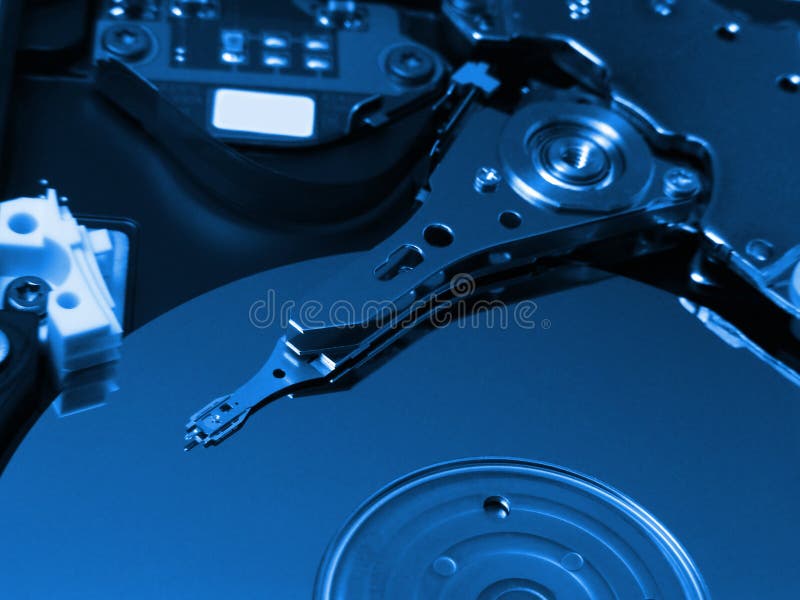 Macro image of hard disk drive in blue tone. Harddisk computer part data disk stock images, royalty-free photos and pictures