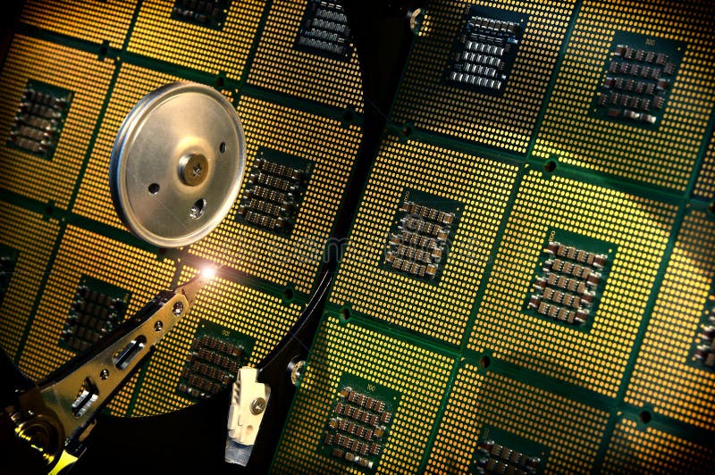 Hard disk drive opened with reflection of processors on the surface of the disk. royalty free stock photos