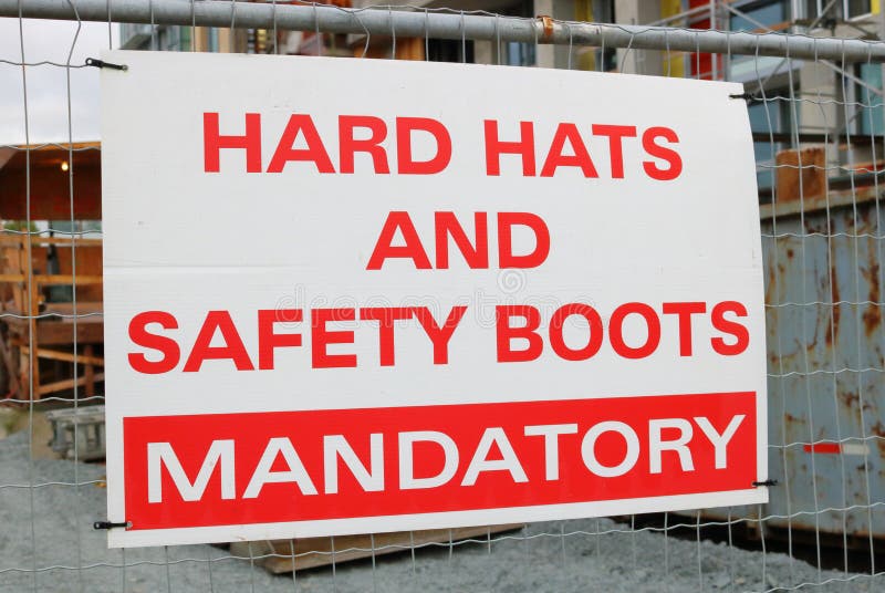Hard hats and safety boots sign stock photos Hard hats and safety boots sign stock photos