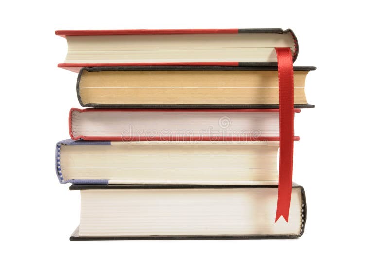 Small pile of books with red bookmark ribbon, isolated on white background royalty free stock photography