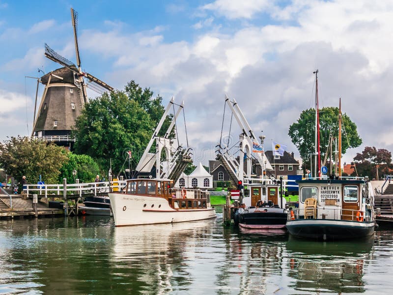 Harderwijk harbor and windmill, Holland