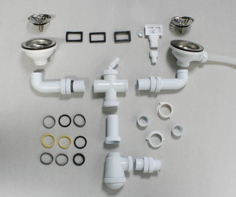 Drain Pipes of a Kitchen Sink with Dishwasher Connection Stock Photo