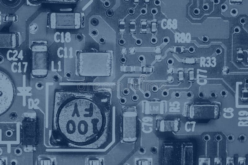 Hardware engineering background: close up photo of integrated circuit colored in blue stock photography