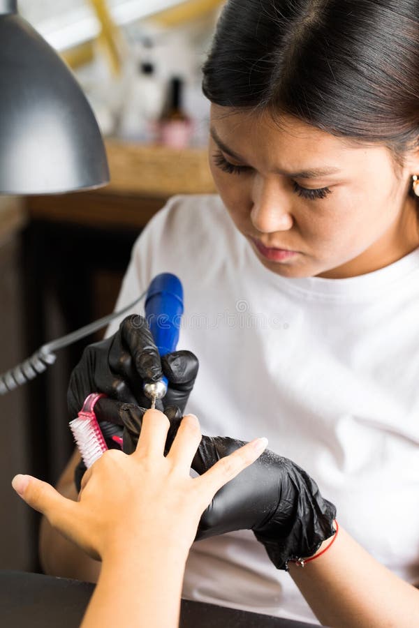 Hardware Manicure. Manicure Process, Cuticle Removal with a Cutter