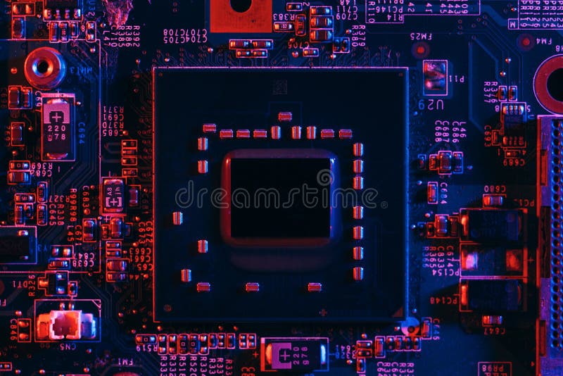 Hardware technology concept in neon light. Motherboard in blue-red light. Computer component. Dark photo. Neon Colors. GPU processor. CPU.