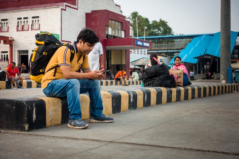 July 4th 2022 Haridwar India. A man with a backpack waiting for the train at the Haridwar railway Station. July 4th 2022 Haridwar India. A man with a backpack waiting for the train at the Haridwar railway Station.