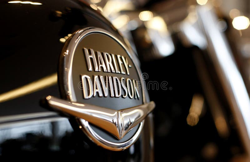 Harley Davidson logo is displayed on a motorcycle in a new Harley show room