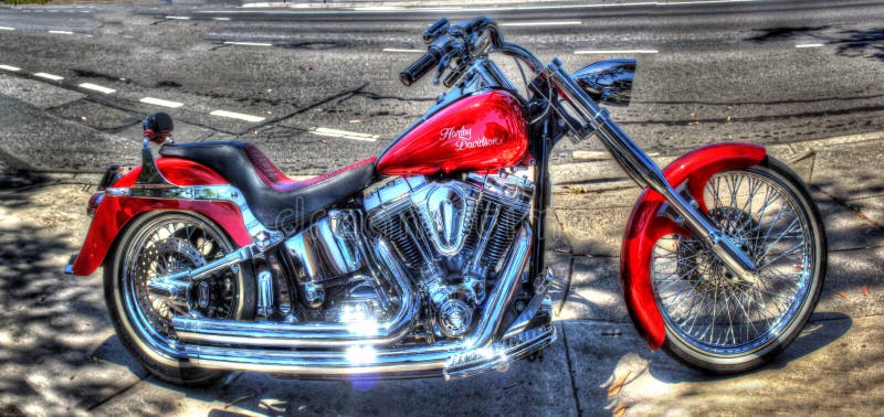 Red Harley Davidson motorcycle on display at car show