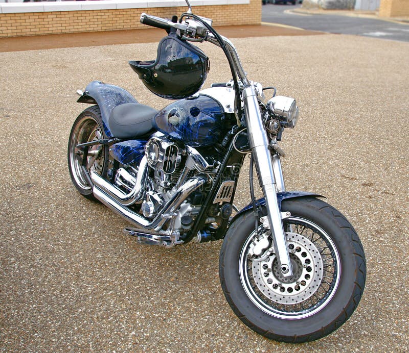 A Harley Davidson super spider bike, with spider-web graphics design paint work, and sparkly chrome engine and exhaust. A Harley Davidson super spider bike, with spider-web graphics design paint work, and sparkly chrome engine and exhaust.