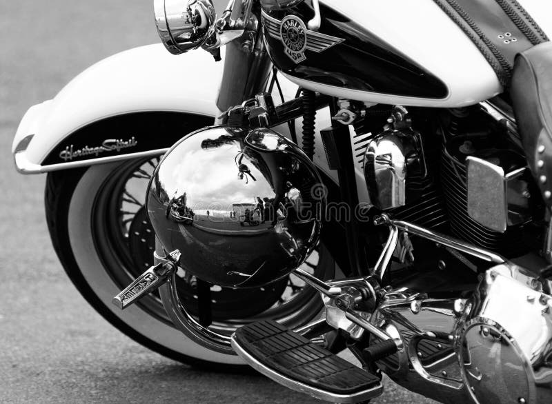 Southend, England - 17 April 2017: A shiny Harley Davidson motorcycle with reflection in polished helmet at the annual shakedown event, Southend, England. Southend, England - 17 April 2017: A shiny Harley Davidson motorcycle with reflection in polished helmet at the annual shakedown event, Southend, England