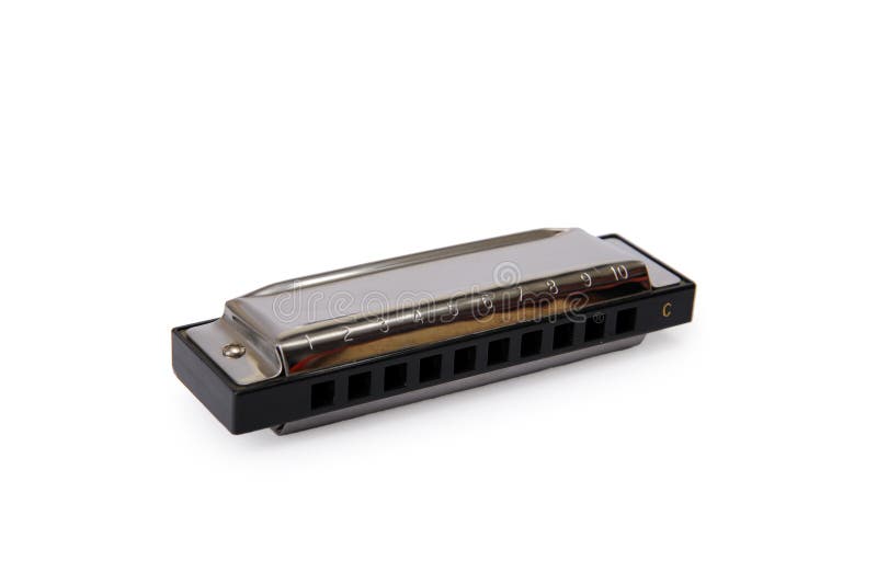 Shiny harmonica on white background