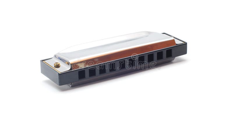 Silver harmonica on white