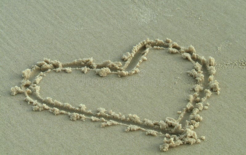 Heart drawn by hand in the wet sand on the beach. Heart drawn by hand in the wet sand on the beach