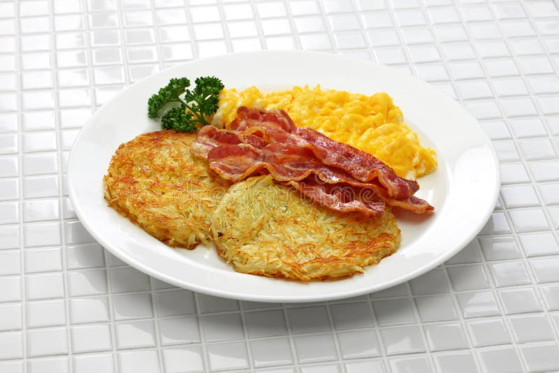 Hash Browns, Scrambled Eggs and Bacon Stock Image Image of potatoes