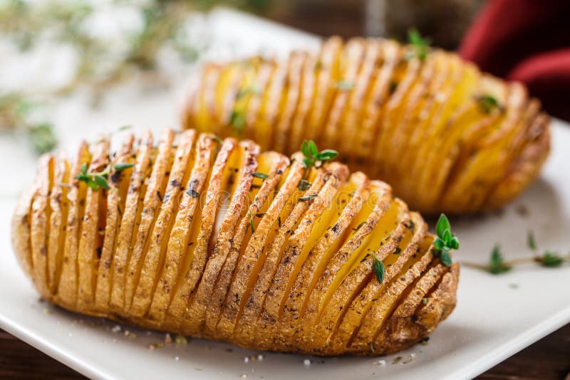 Hasselback potatoes stock image. Image of herb, prepared 51641137