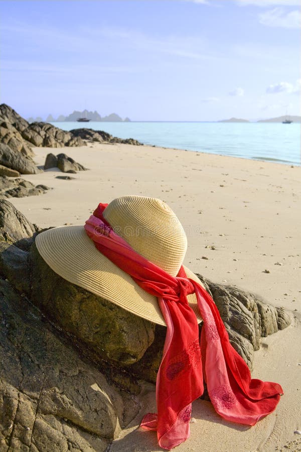 Hat on the rocks at the beach