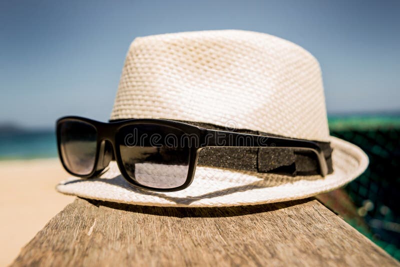 Hat and Sunglasses at the Sea Background. Stock Photo - Image of