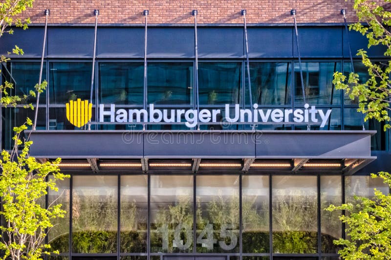 West Loop, Chicago-May 4, 2019: Entrance sign to Hamburger University, McDonald`s Corporate Headquarters located on the Near West Side. Main street in Chicago. Illinois business. West Loop, Chicago-May 4, 2019: Entrance sign to Hamburger University, McDonald`s Corporate Headquarters located on the Near West Side. Main street in Chicago. Illinois business