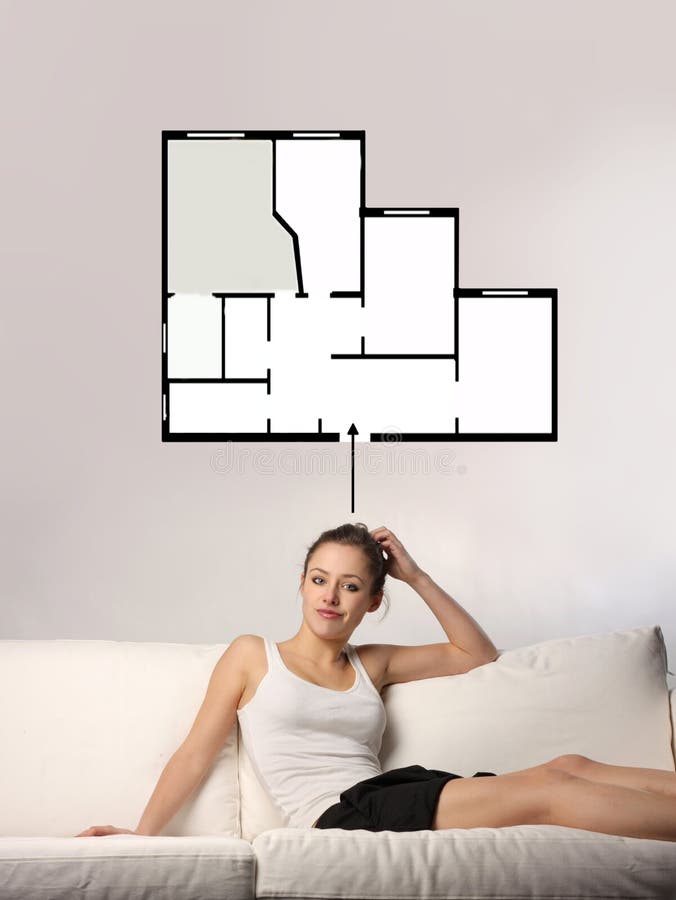 A woman thinking about the home blueprint. A woman thinking about the home blueprint