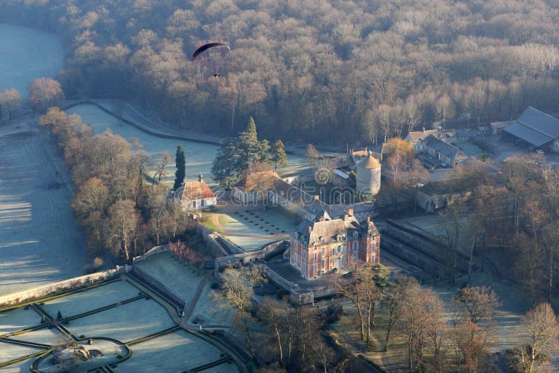 Haut Rosay castle and paramotor seen fron the sky in the Yvelines department , France royalty free stock photo Haut Rosay castle and paramotor seen fron the sky in the Yvelines department , France royalty free stock photo