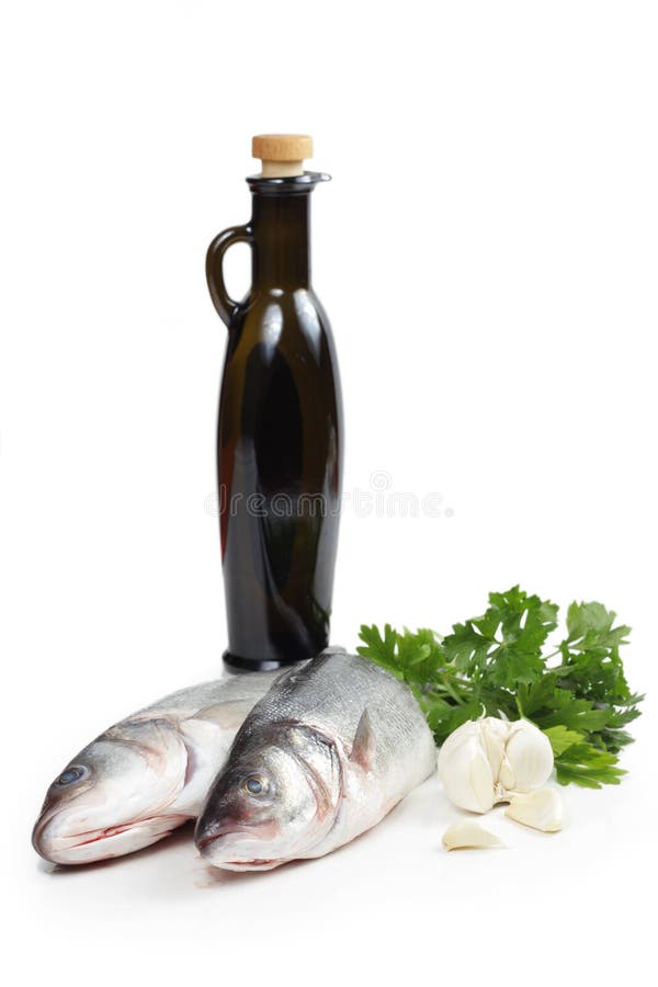 Hav för parsley för bas- fiskvitlökolja olive arkivfoto