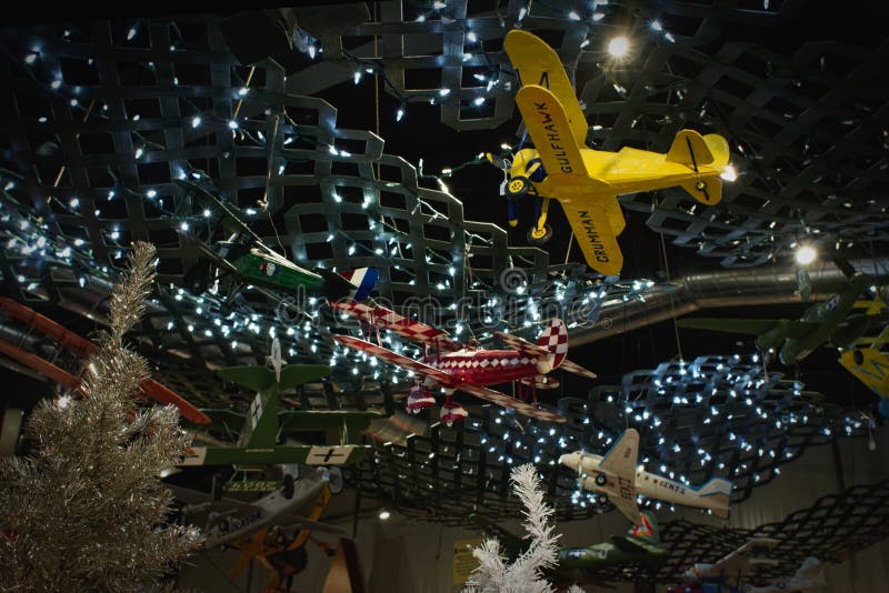 A sea of paper Mache models of vintage airplanes hang from the ceiling surrounded by Christmas decorations at the Aviation Museum of New Hampshire. Londonderry, New Hampshire. A sea of paper Mache models of vintage airplanes hang from the ceiling surrounded by Christmas decorations at the Aviation Museum of New Hampshire. Londonderry, New Hampshire